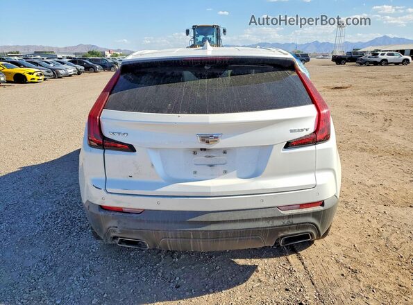 1GYAZAR4XKF220830 2019 CADILLAC XT4 White უკანა ხედი