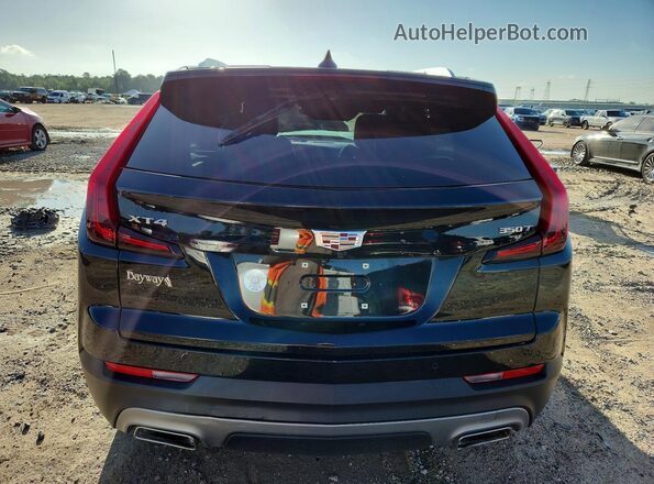 1GYFZCR4XPF164087 2023 CADILLAC XT4 Black Вид ззаду