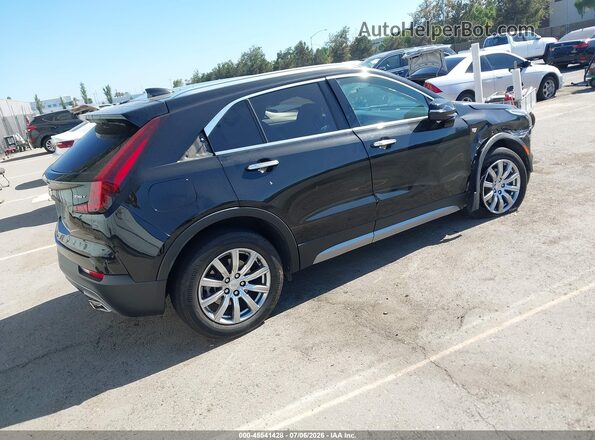 1GYFZDR40NF127200 2022 CADILLAC XT4 Black Trasero derecho