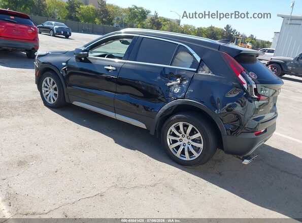 1GYFZDR40NF127200 2022 CADILLAC XT4 Black Trasero izquierdo