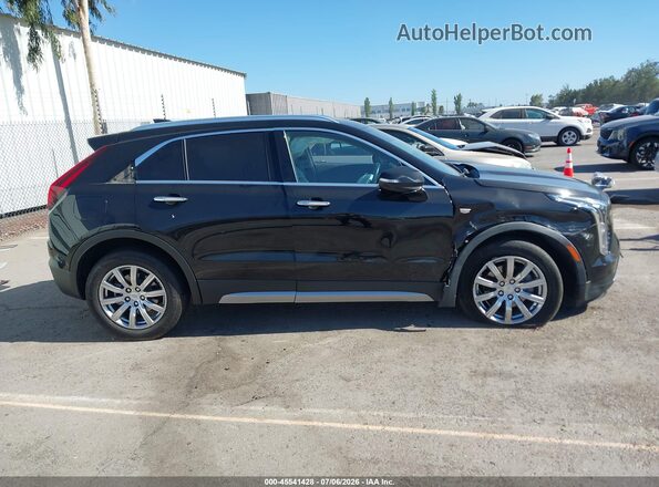 1GYFZDR40NF127200 2022 CADILLAC XT4 Black Vista interior trasera