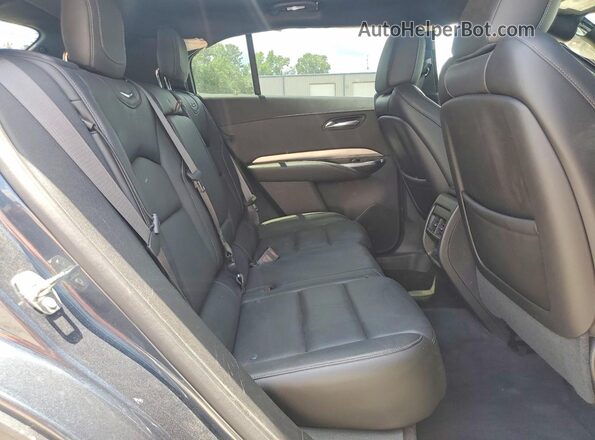 1GYFZDR43KF101072 2019 CADILLAC XT4 Серый Вид задней части салона