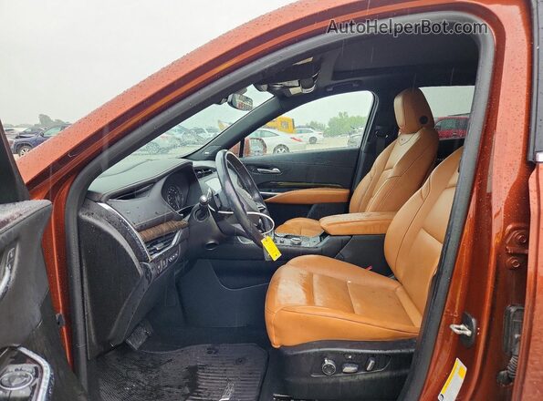 1GYFZDR49KF130768 2019 CADILLAC XT4 Оранжевый Вид салона спереди