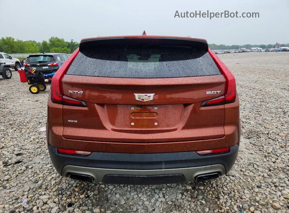1GYFZDR49KF130768 2019 CADILLAC XT4 Оранжевый Вид сзади
