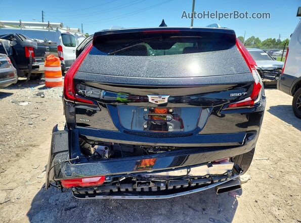 1GYFZDR49MF020175 2021 CADILLAC XT4 Black უკანა ხედი