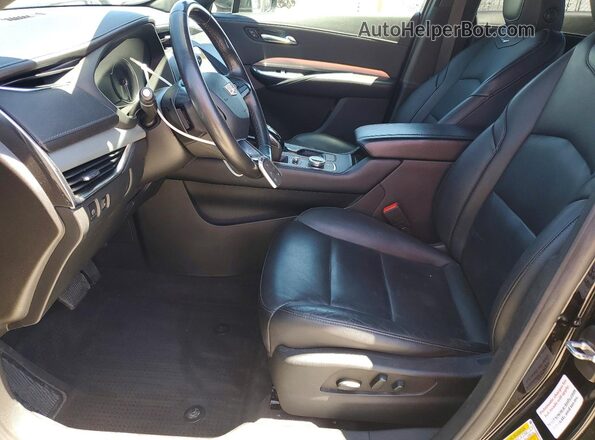 1GYFZDR49NF100125 2022 CADILLAC XT4 Black წინა სალონის ხედი