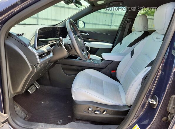1GYFZER41RF124866 2024 CADILLAC XT4 Синий Вид салона спереди