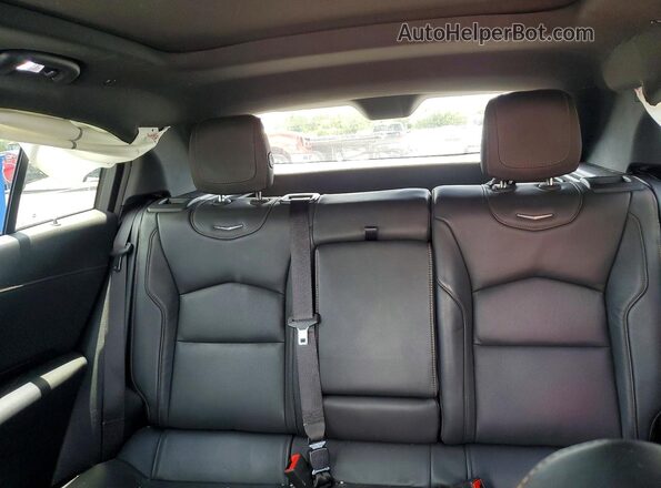 1GYFZER46LF017447 2020 CADILLAC XT4 Red Rear seats view