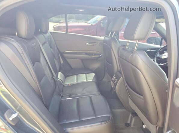 1GYFZER47KF174046 2019 CADILLAC XT4 Серый Вид задней части салона