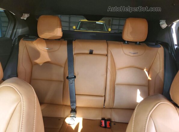 1GYFZFR40RF159100 2024 CADILLAC XT4 White Vista de los asientos traseros