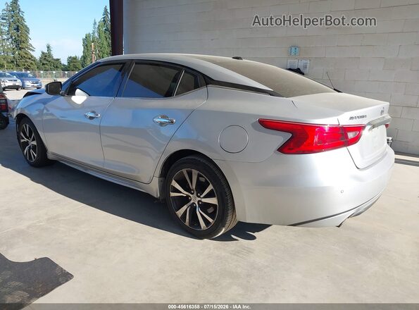 1N4AA6AP0JC386098 2018 NISSAN MAXIMA Серебряный Задняя левая четверть
