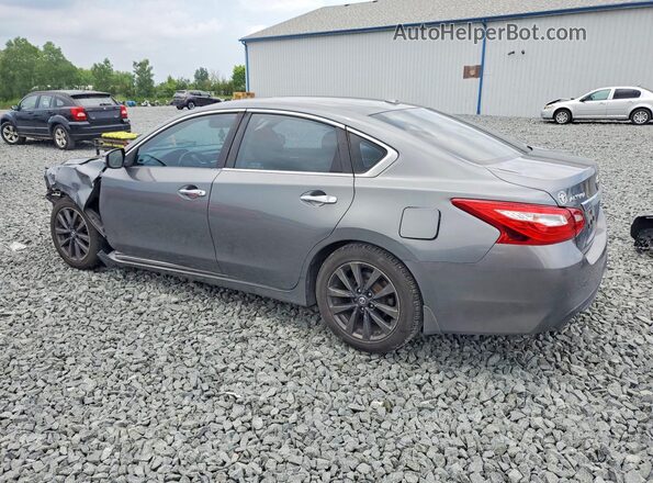 1N4AL3AP7GC128839 2016 NISSAN ALTIMA Silver Trasero izquierdo