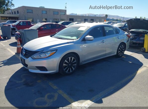 1N4AL3AP7JC247496 2018 NISSAN ALTIMA Silver Vista tres cuartos delantera izquierda