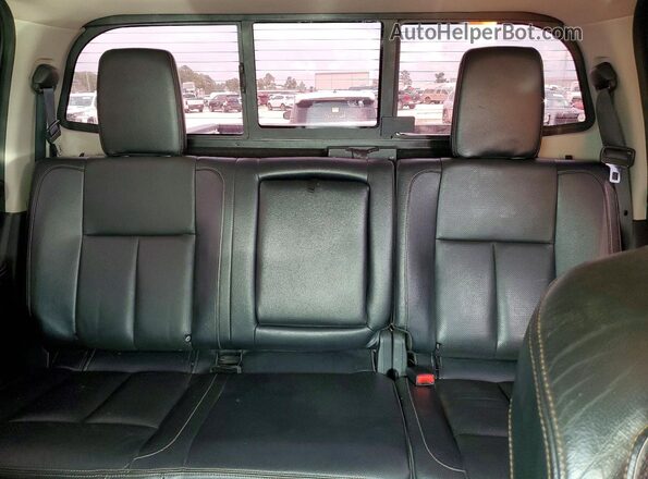 1N6BA1F22GN509733 2016 NISSAN TITAN Brown Vista de los asientos traseros