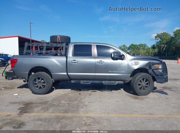 1N6BA1F38HN565864 2017 NISSAN TITAN XD Серебряный Вид задней части салона