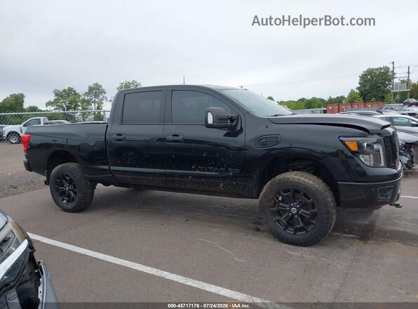 1N6BA1F40JN520285 2018 NISSAN TITAN XD Black Вид задньої частини салону