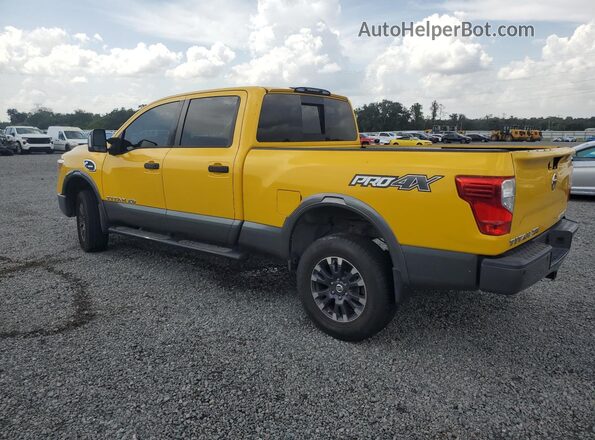 1N6BA1F45GN511350 2016 NISSAN TITAN Yellow Trasero izquierdo