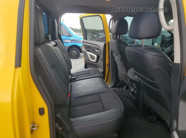 1N6BA1F45GN511350 2016 NISSAN TITAN Yellow Vista de los asientos traseros