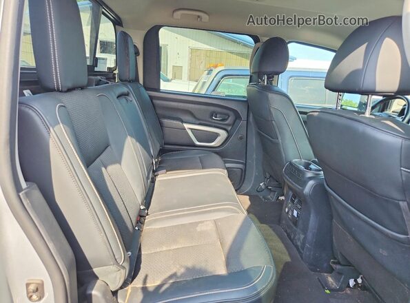 1N6BA1F47KN533424 2019 NISSAN TITAN Silver Rear seats view