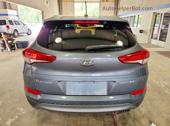 KM8J33A22GU183395 2016 HYUNDAI TUCSON Gray Front interior view