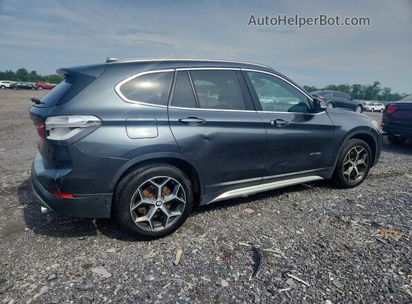 WBXHT3C33H5F72590 2017 BMW X1 Серый Передняя правая четверть