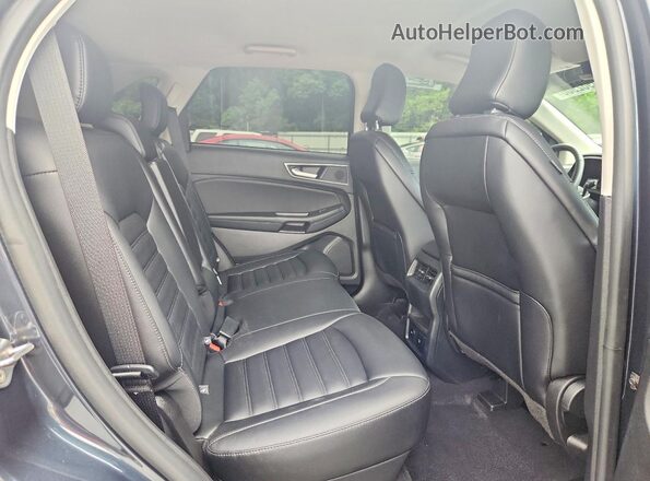 2FMPK4J92RBA44988 2024 FORD EDGE Blue Widok wnętrza z tyłu