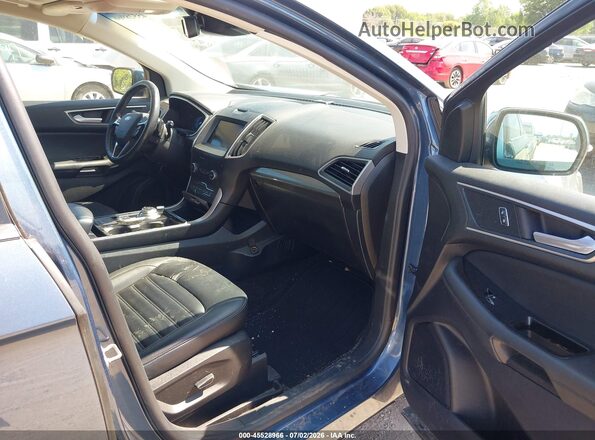 2FMPK4J93KBB76275 2019 FORD EDGE Blue Widok wnętrza z przodu