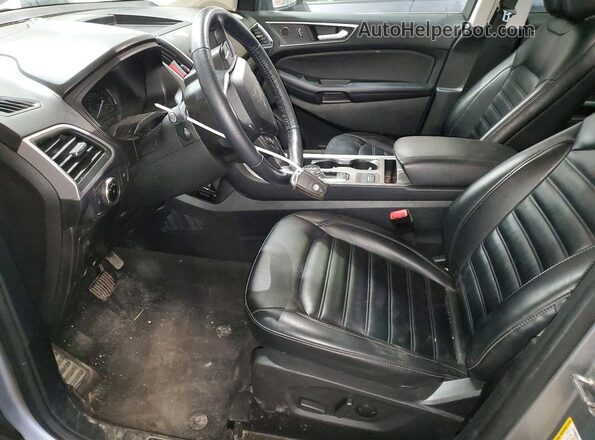 2FMPK4J93PBA38937 2023 FORD EDGE Серебряный Вид салона спереди
