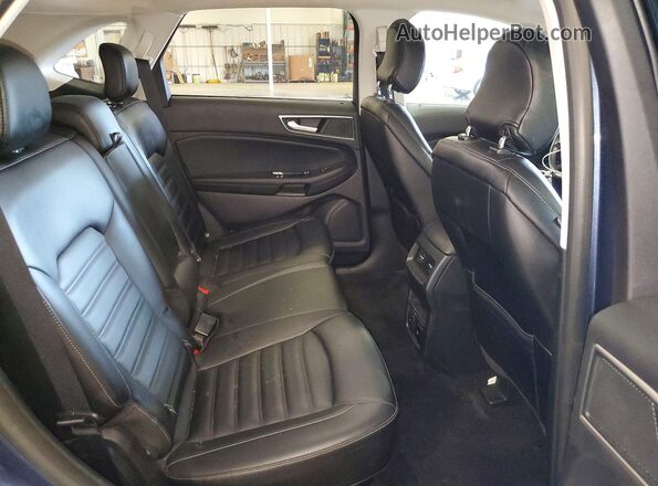 2FMPK4J97KBC40317 2019 FORD EDGE Blue Widok wnętrza z tyłu