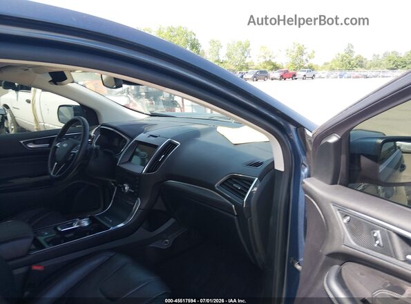 2FMPK4K92KBB45775 2019 FORD EDGE Blue Front interior view