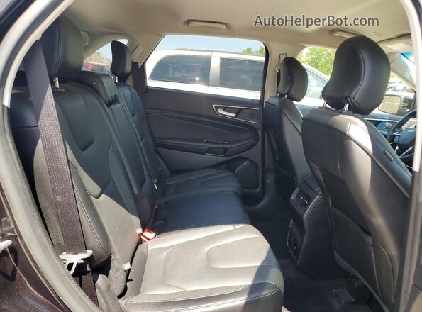 2FMPK4K93KBB15314 2019 FORD EDGE Black Vista interior trasera
