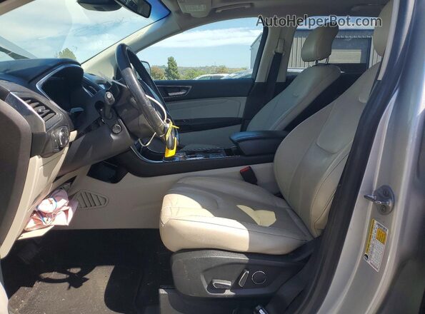 2FMPK4K94KBB93634 2019 FORD EDGE Серебряный Вид салона спереди