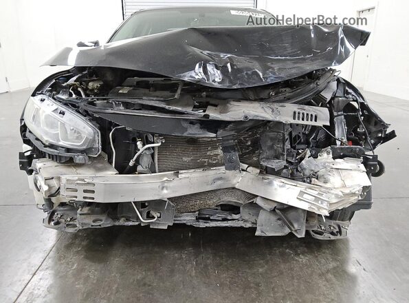 2HGFC2F57JH583584 2018 HONDA CIVIC Black Vista de la etiqueta del VIN