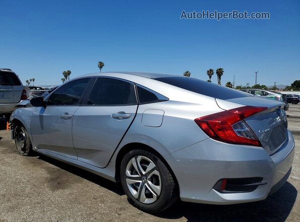 2HGFC2F59JH582565 2018 HONDA CIVIC Silver Trasero izquierdo