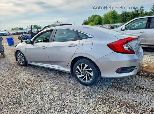 2HGFC2F67JH043242 2018 HONDA CIVIC Silver Trasero izquierdo