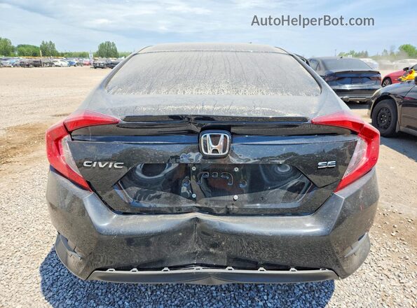 2HGFC2F6XJH044319 2018 HONDA CIVIC Black Rear view