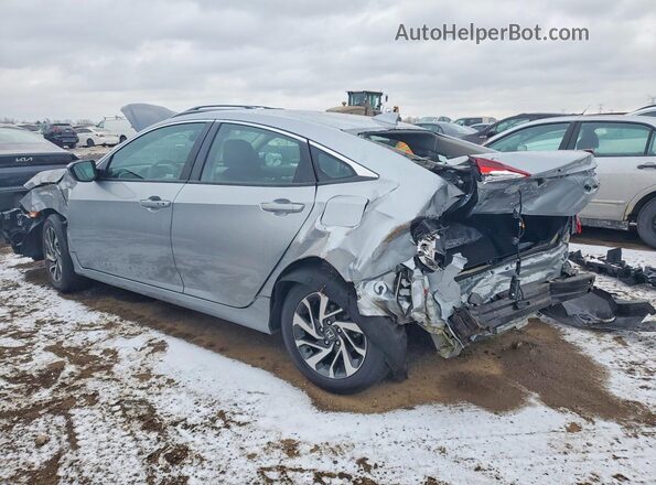 2HGFC2F79JH585970 2018 HONDA CIVIC Silver Trasero izquierdo