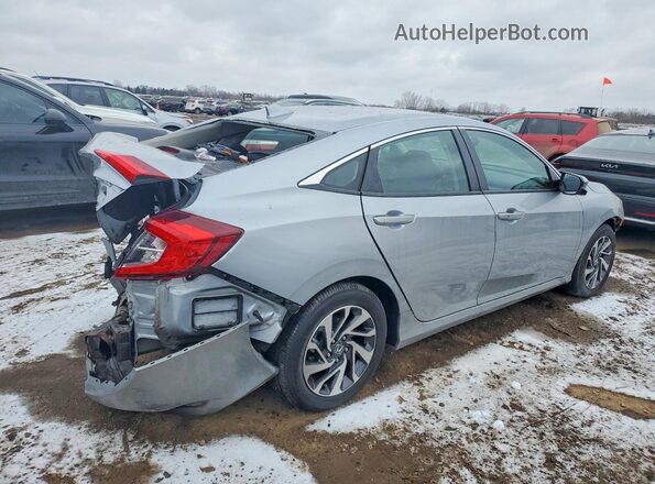 2HGFC2F79JH585970 2018 HONDA CIVIC Silver Trasero derecho
