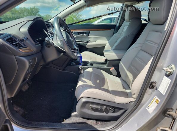 2HKRW2H80KH669371 2019 HONDA CR-V Серебряный Вид салона спереди