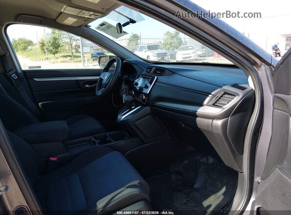 2HKRW5H30KH404276 2019 HONDA CR-V Серебряный Вид салона спереди