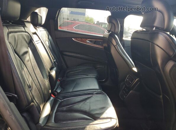 2LMTJ8LP0GBL22891 2016 LINCOLN MKX Black Սալոնի հետևի տեսք