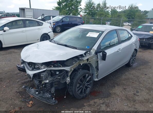 2T1BURHE0HC810568 2017 TOYOTA COROLLA Серебряный Передняя левая четверть