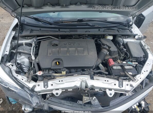 2T1BURHE0HC810568 2017 TOYOTA COROLLA Серебряный Вид сзади