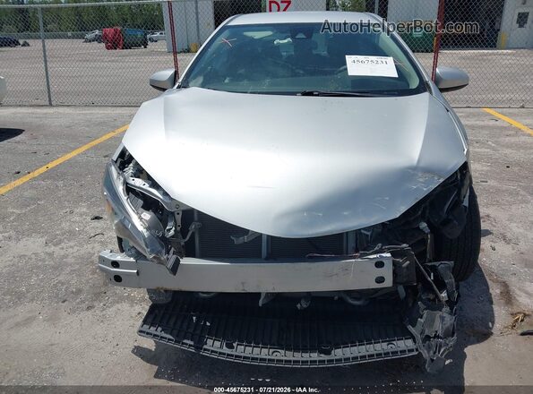 2T1BURHE1KC203635 2019 TOYOTA COROLLA Silver Vista frontal