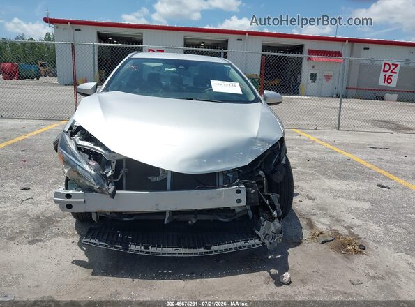 2T1BURHE1KC203635 2019 TOYOTA COROLLA Silver Vista interior trasera