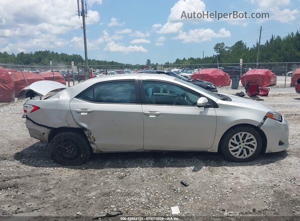 2T1BURHE3HC851700 2017 TOYOTA COROLLA Silver Vista interior trasera