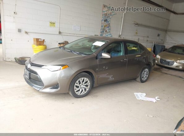 2T1BURHE3HC938030 2017 TOYOTA COROLLA Brown Vista tres cuartos delantera izquierda