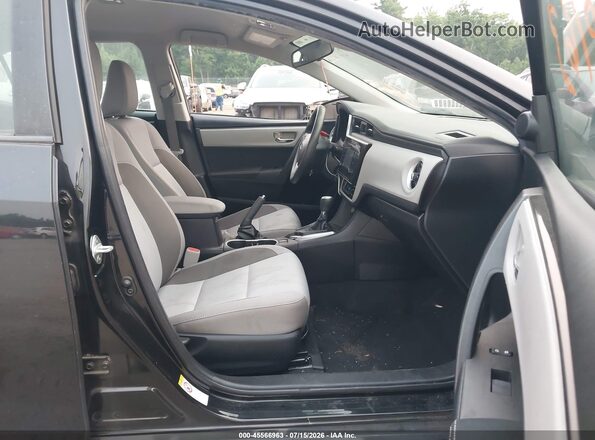 2T1BURHE3KC199541 2019 TOYOTA COROLLA Черный Вид салона спереди