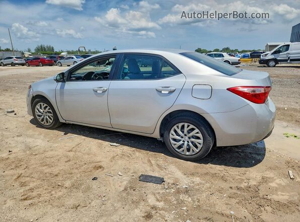 2T1BURHE5HC818102 2017 TOYOTA COROLLA Silver Trasero izquierdo