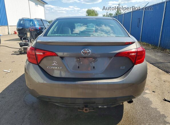 2T1BURHE6HC864456 2017 TOYOTA COROLLA Бежевый Вид сзади